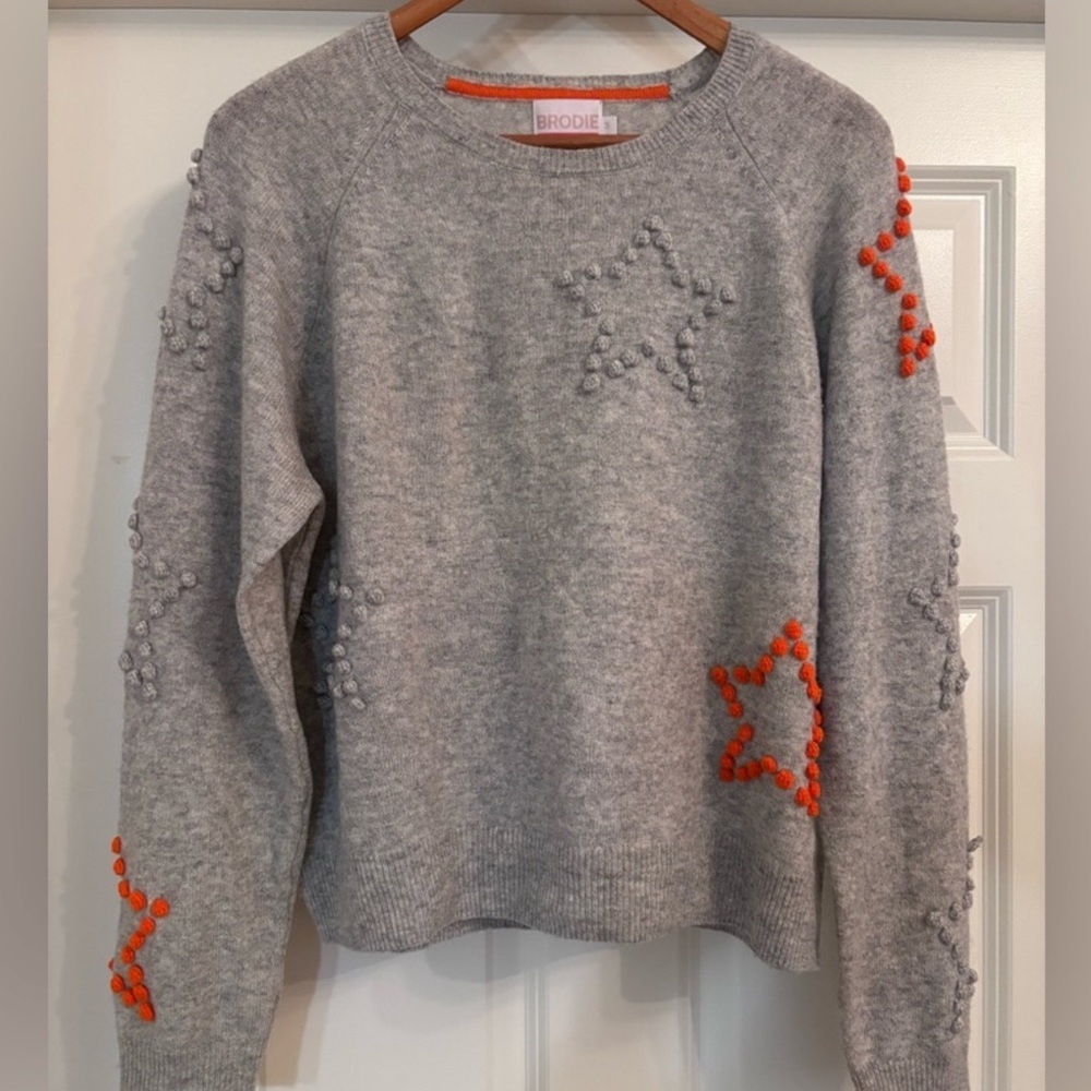 Brodie Cashmere Starlight PomPom Gray and Orange Star Sweater